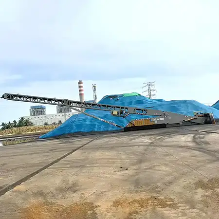 Self-feeding truck loader conveyor